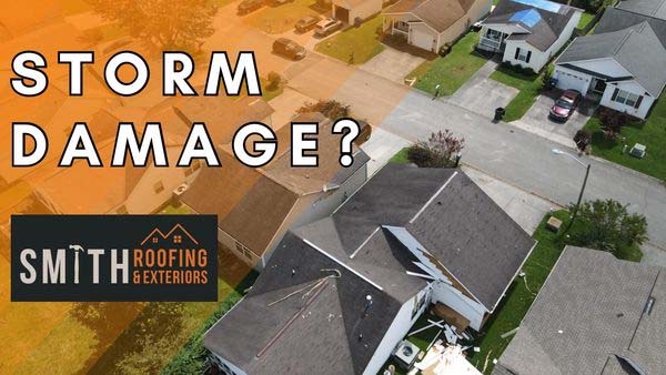 An overhead view of houses with roof damage from hurricane Idalia.