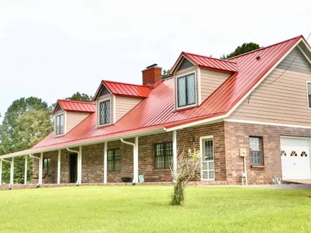 House with red metal roof