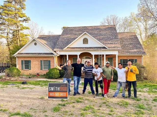 Smith Roofing team with newly completed Asphalt Roof