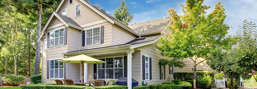 beige house with brown shingles