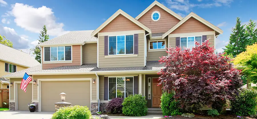house with gray roof and brown siding