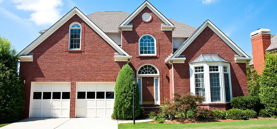 red brick house with grey shingles