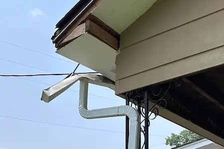damaged gutter on East Drive in Oak Ridge before repair
