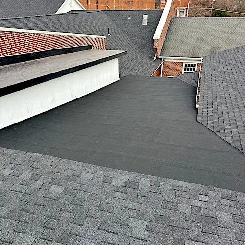 mixed roofing materials shown on a Knoxville church roof