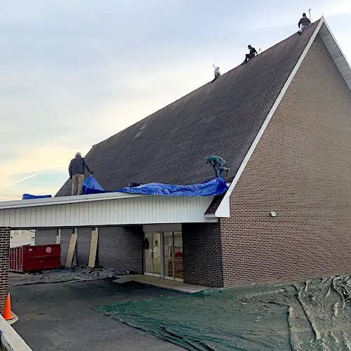 The entryway of Newport Church of God showing the roofing crew access