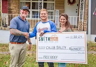 Chris Smith with Hometown Heros roof giveaway winners